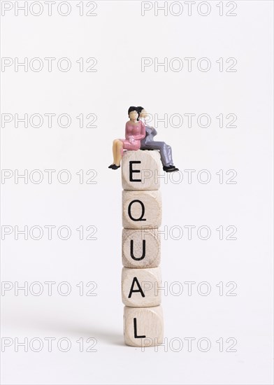 Business woman man sitting pile wooden cubes