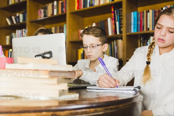 Children working hard home assignment