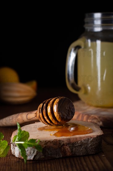 Close up delicious honey stick lemonade jar