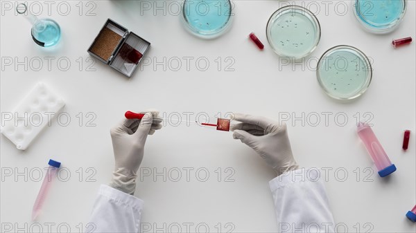 Close up hands holding pipette