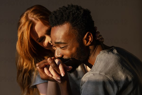 Close up man kissing woman s hand