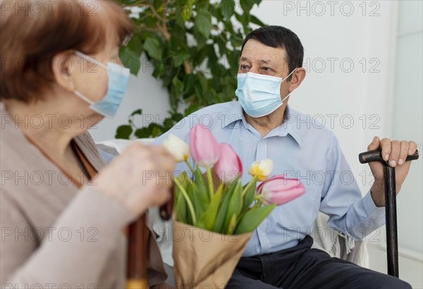 Close up man woman wearing masks