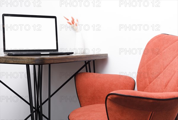 Close up modern chair with laptop ondesk