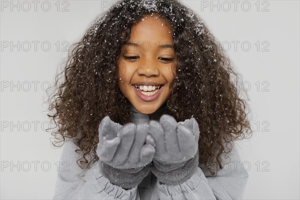 Close up smiley girl wearing gloves