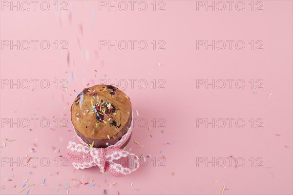 Colorful sprinkles falling easter cake