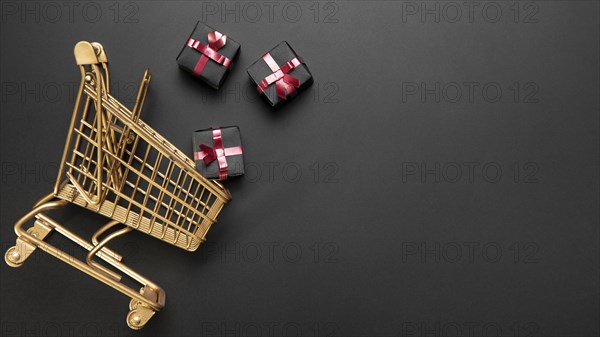 Composition black friday shopping cart with copy space