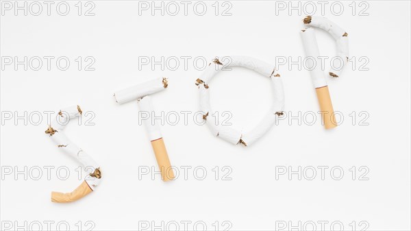 Concept stop smoking made from cigarette against white backdrop