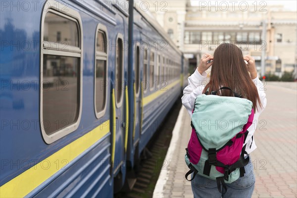 Cute girl railway station from shot