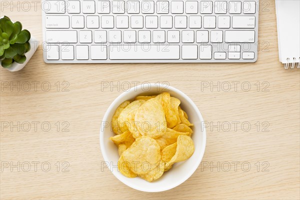 Desk with potato chips bowl