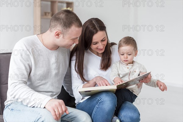 Family with child book home