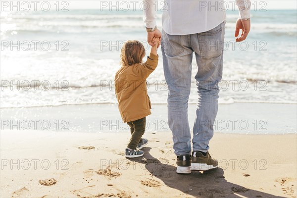 Father with son looking sea