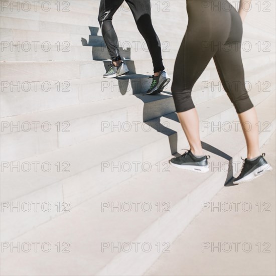 Fit girls walking up stairs