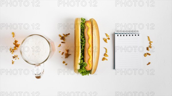 Flat lay hotdog with notepad mock up