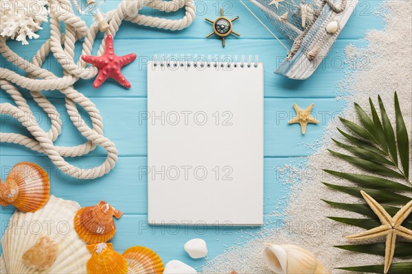 Flat lay notebook with beach concept
