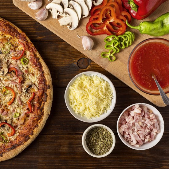 Flat lay pizza with pepper ingredients