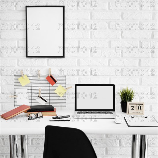 Front view office desk with laptop chair