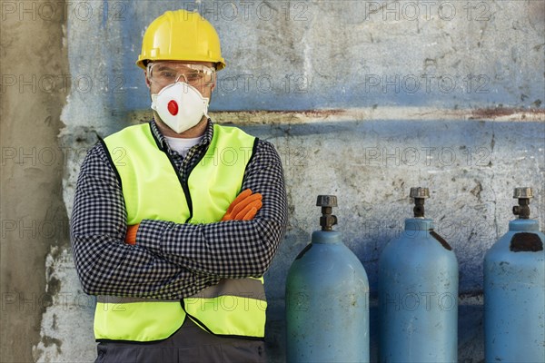 Front view worker with hard hat protective mask