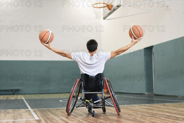 Full shot man holding basketballs