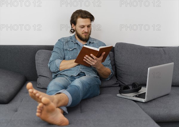 Full shot man reading book