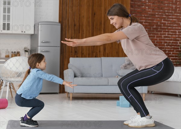 Full shot mother kid exercising