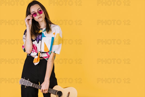 Girl holding ukelele