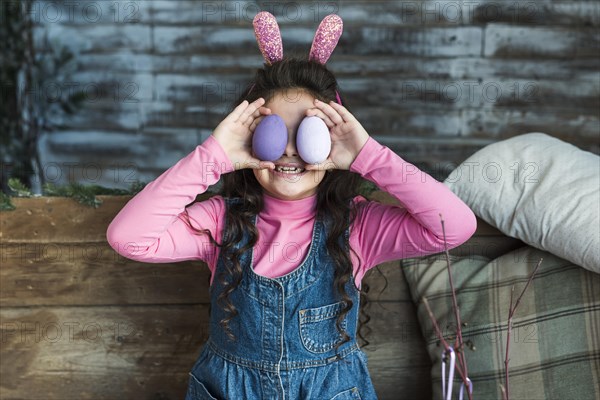 Girl with easter eggs smiling