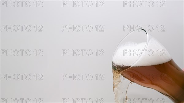 Glass beer pouring with copy space