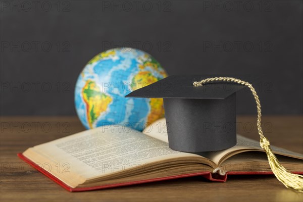 Graduation cap earth globe arrangement