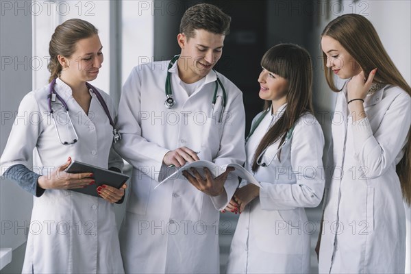 Group medics with papers clinic