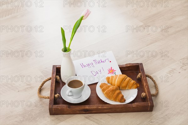Happy mothers day inscription with coffee tray