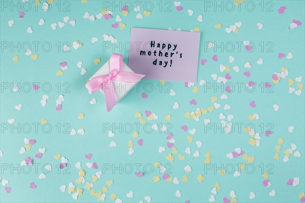 Happy mothers day inscription with small gift box