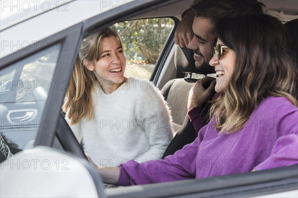 Happy people riding car