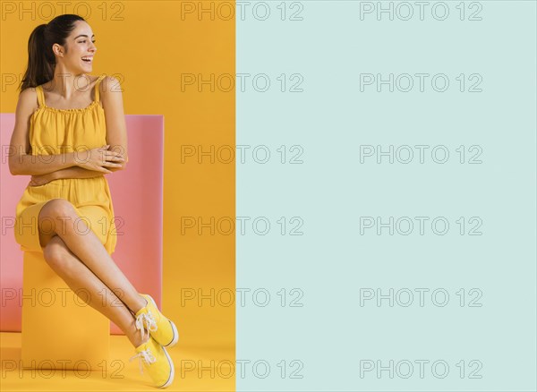 Happy woman yellow dress