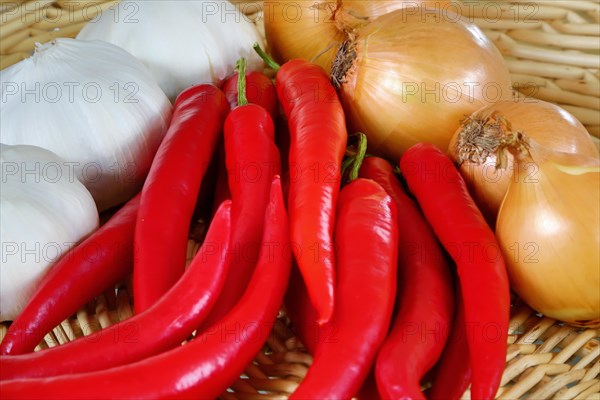 A woven basket filled with red chilli peppers