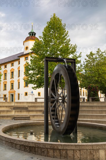 Mill wheel fountain in front of the residence