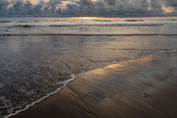 Sunset on sandy beach
