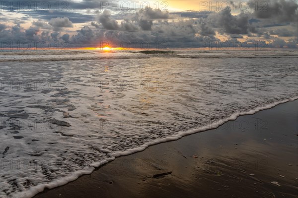 Sunset on sandy beach
