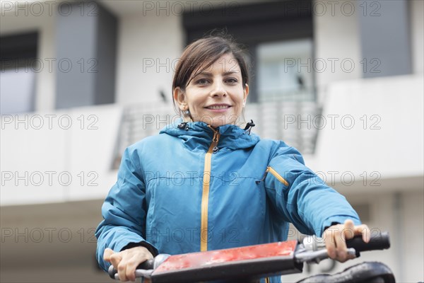 Woman uses hire bike in the city