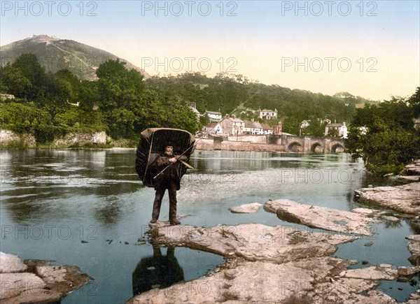 Angler with rain shelter