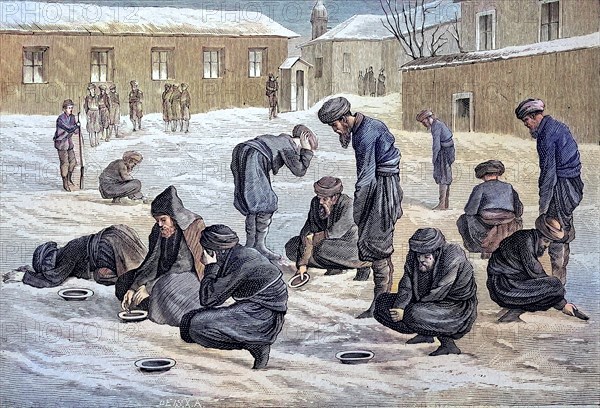 Turkish prisoners in Russia perform their ablutions and prayers in the snow-covered courtyard