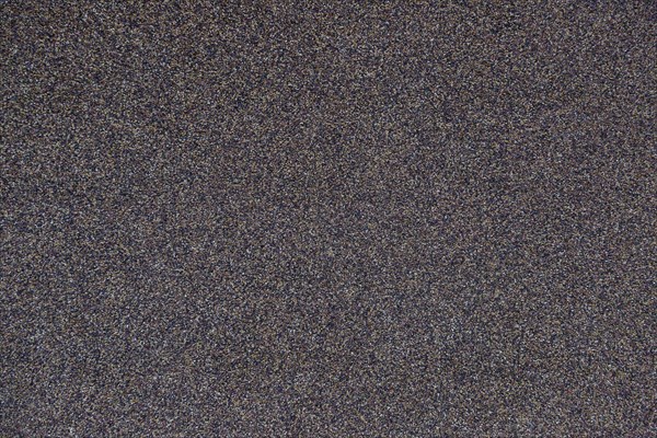 A surface with many small colourful stones