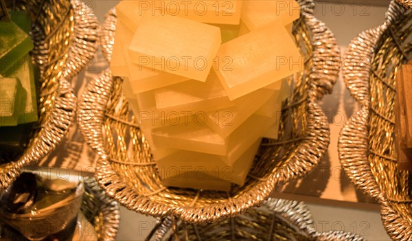 Collection of bars of fragrant hand made organic soap in a basket