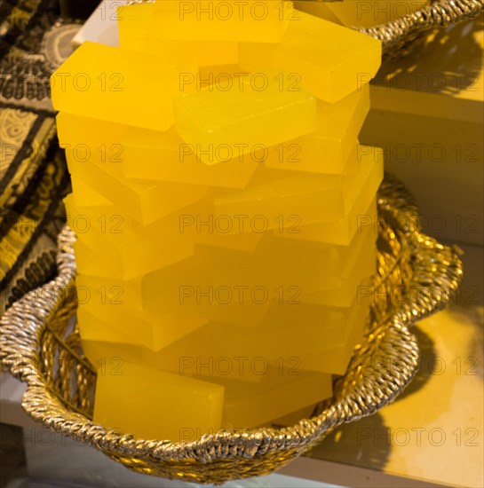 Collection of bars of fragrant hand made organic soap in a basket