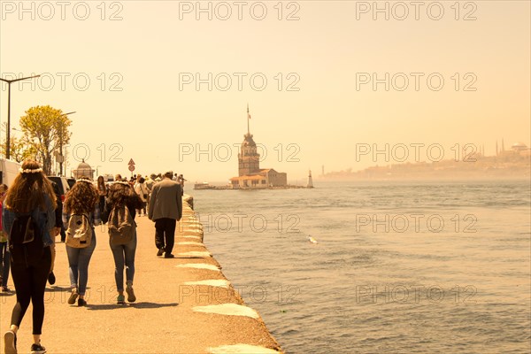 People towards Maidens Tower located in the middle of Bosporus