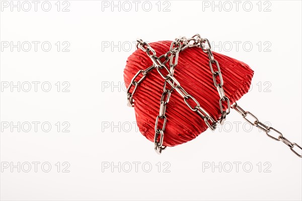 Red color heart shaped object in Chain on white background