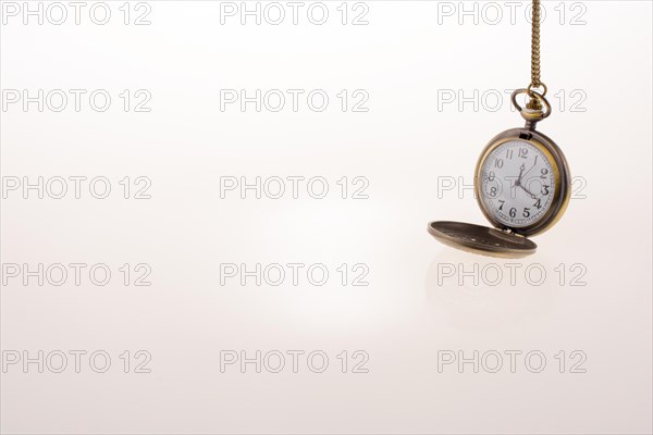 Isolated retro styled pocket watch on white background