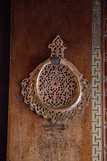 Old Handmade ottoman door knob on wood