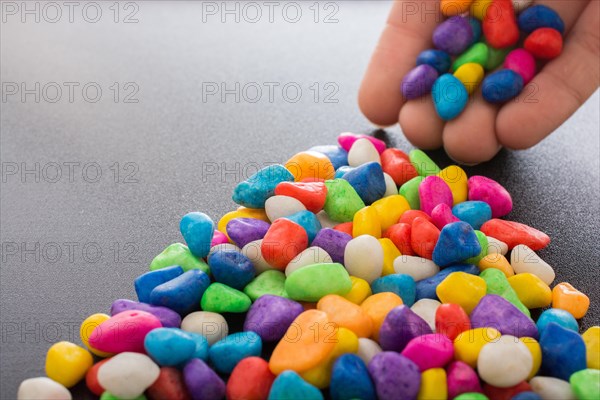 Pile of little colorful pebbles as stone background