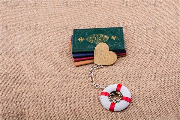 Little books attached to a life saver with a chain