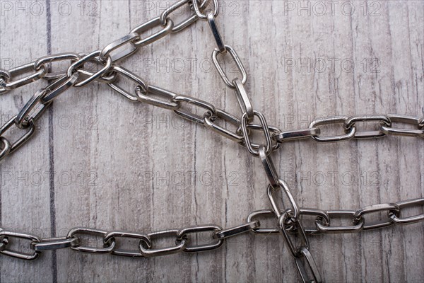 Chain made of silver color metal on grey background